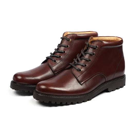 Rugged handmade boots in deep burgundy with lace-up front and gripped sole – designed for comfort and strength.