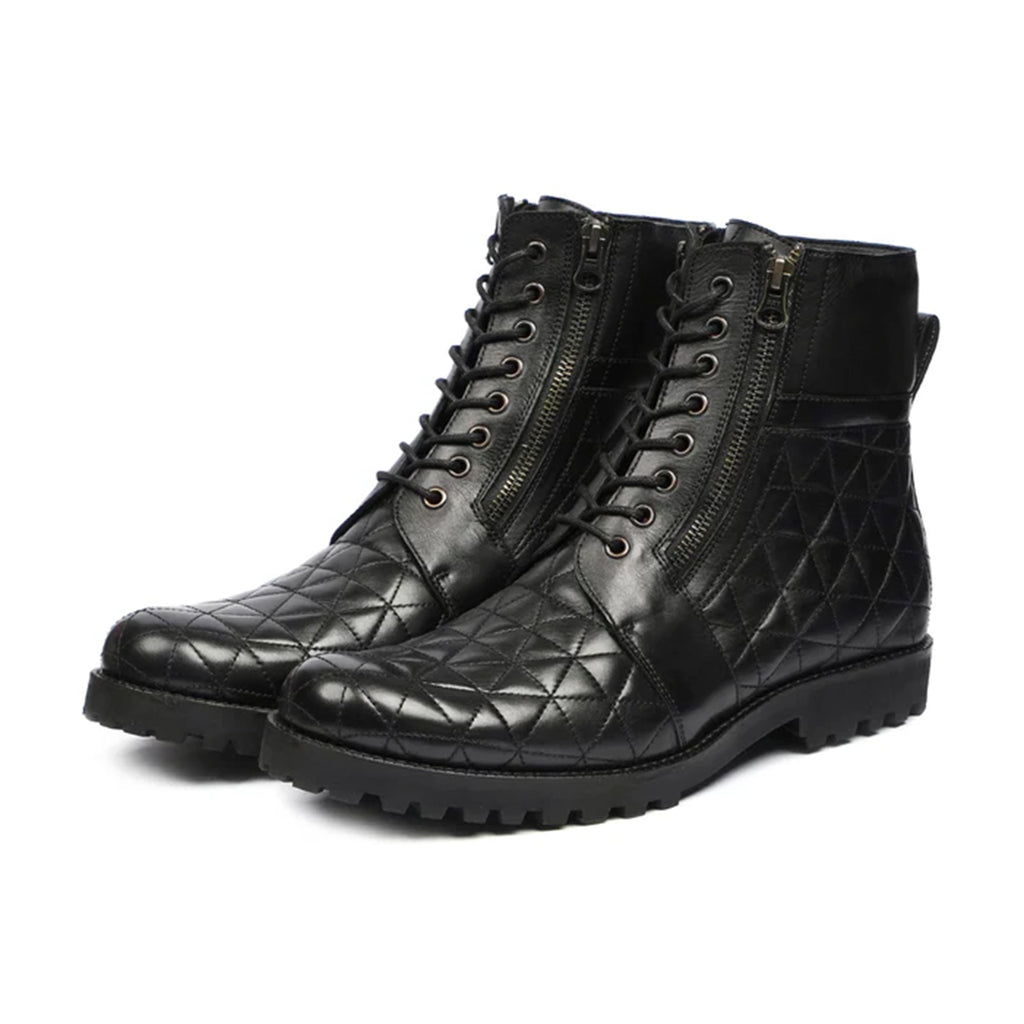 Luxurious handmade quilted boots in black, shown from the front angle. Perfect formal footwear for men crafted in Pakistan.
