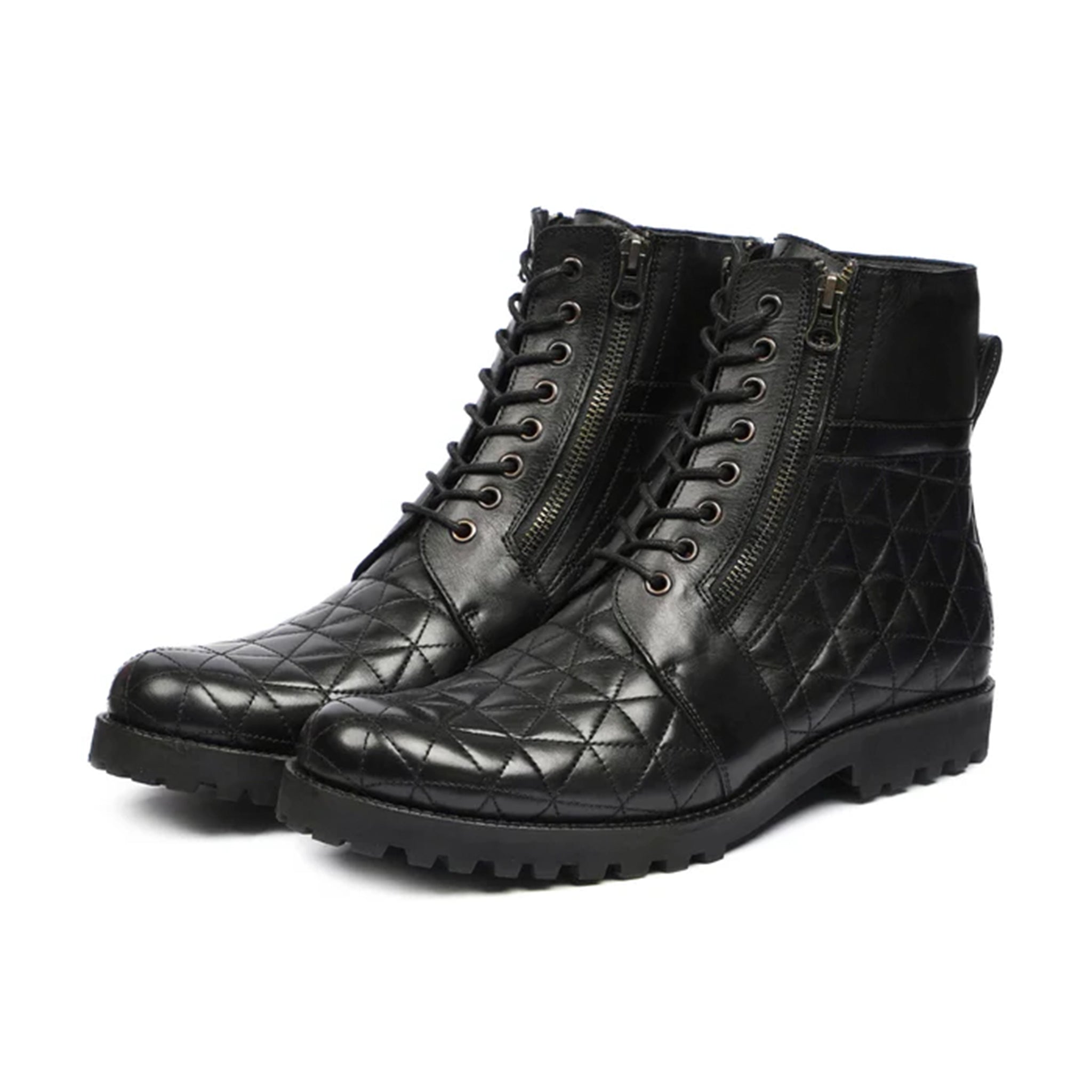 Luxurious handmade quilted boots in black, shown from the front angle. Perfect formal footwear for men crafted in Pakistan.

