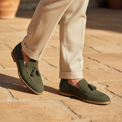 Luxury lifestyle image featuring the Texa Olive Suede Tassel Loafers handcrafted by Marvel Leather and worn in an elegant resort-inspired setting.