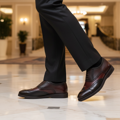 Luxury lifestyle image featuring the Vincenzo Two Tone Wingtip Brogue Oxfords handcrafted by Marvel Leather and worn in an elegant premium setting.